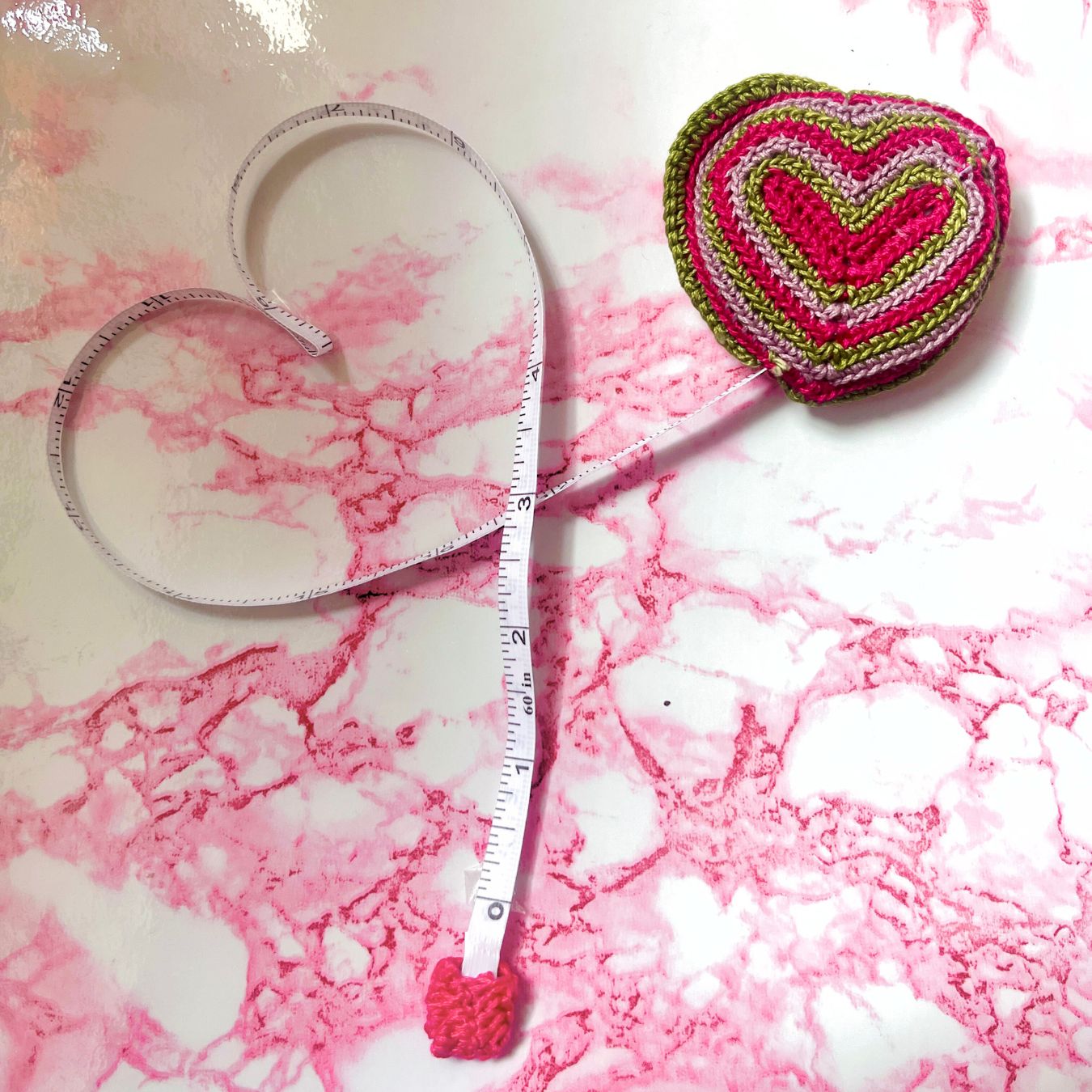 pink tape measure heart