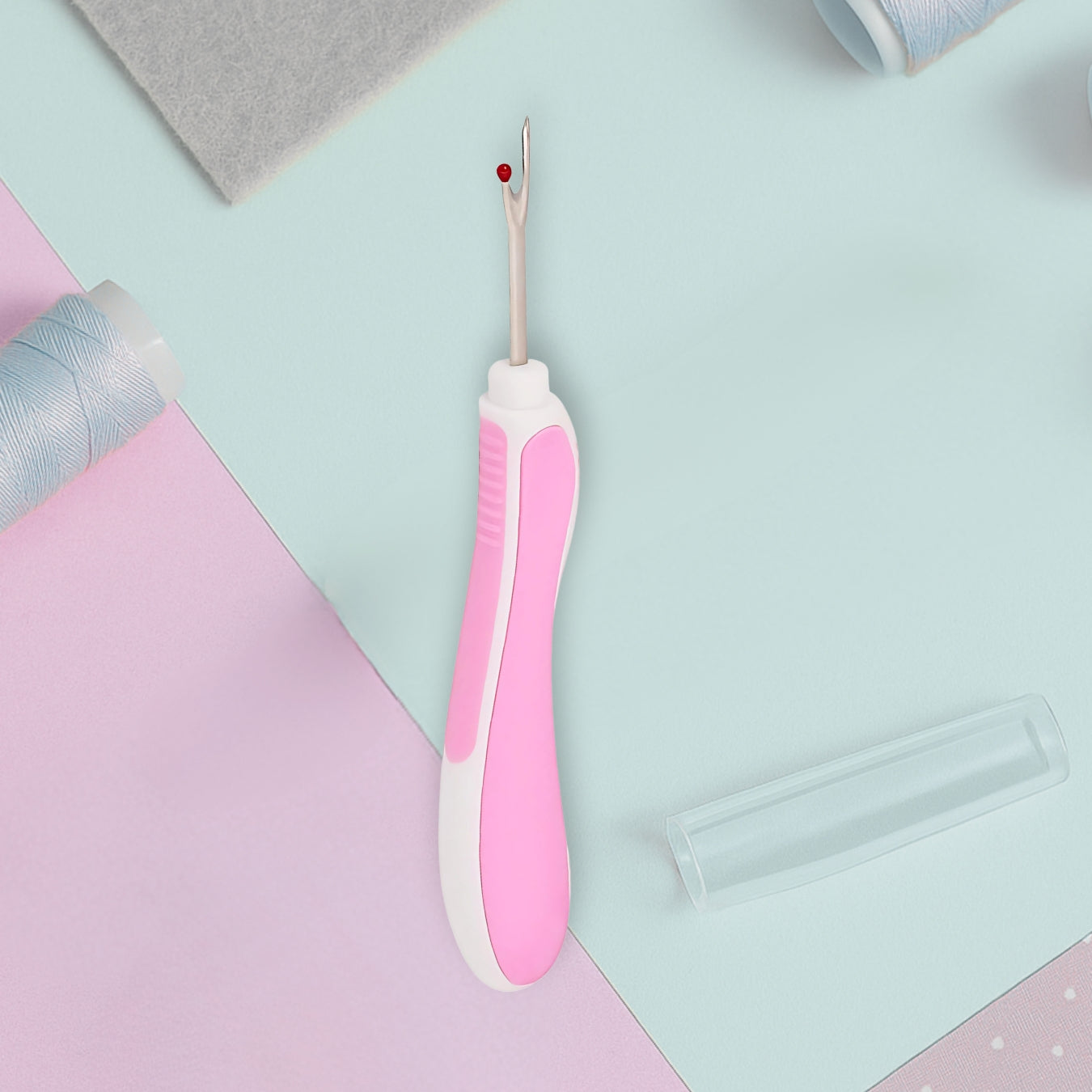 white and pink seam ripper