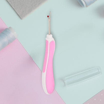 white and pink seam ripper